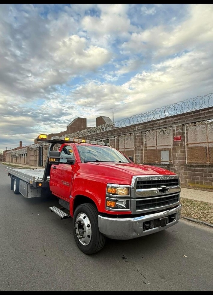 Carmon's Towing red rollback tow truck